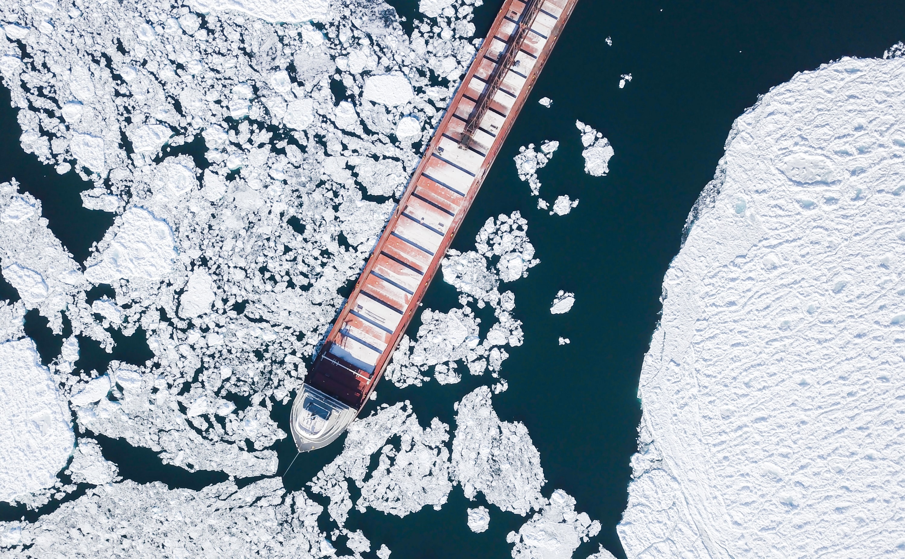 Ship breaking down icebergs.